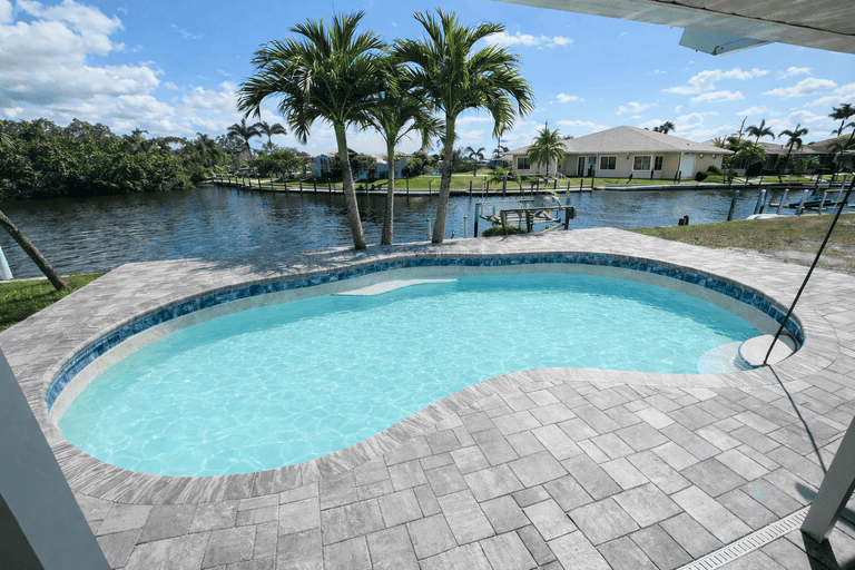 Residential pool deck paver installation in Tampa Bay at a residential property