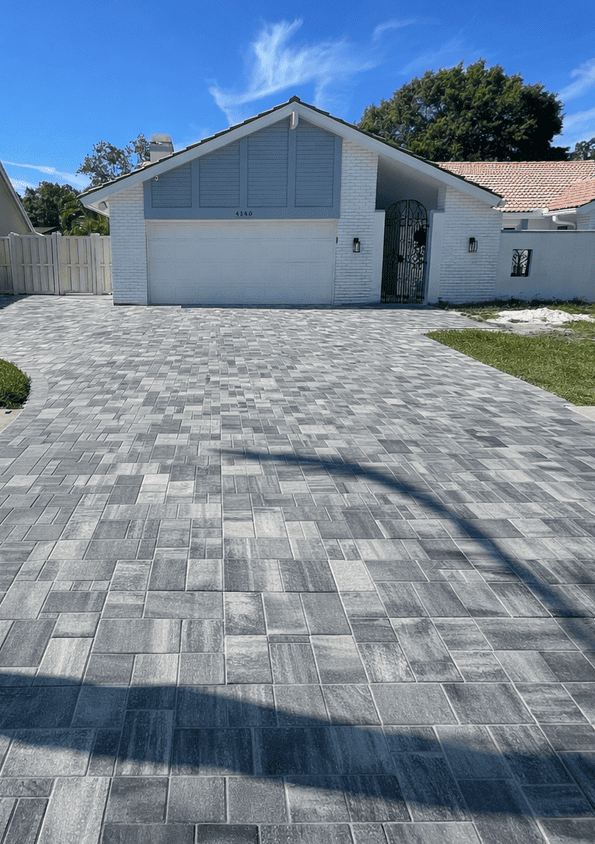 Residential driveway paver installation in Tampa Bay at a residential property