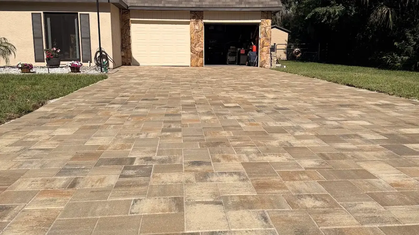 concrete vs pavers shown in a real Tampa Bay outdoor project