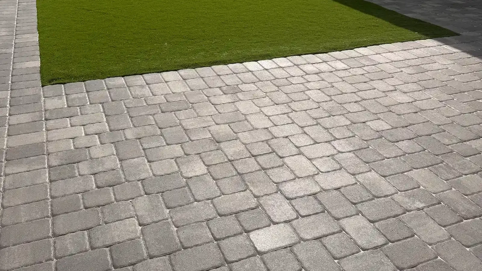 artificial turf vs natural grass shown in a real Tampa Bay outdoor project