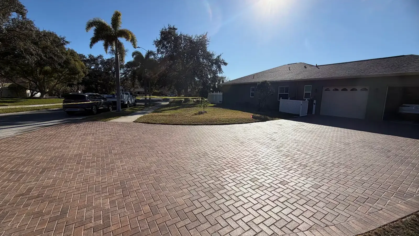 asphalt vs pavers shown in a real Tampa Bay outdoor project