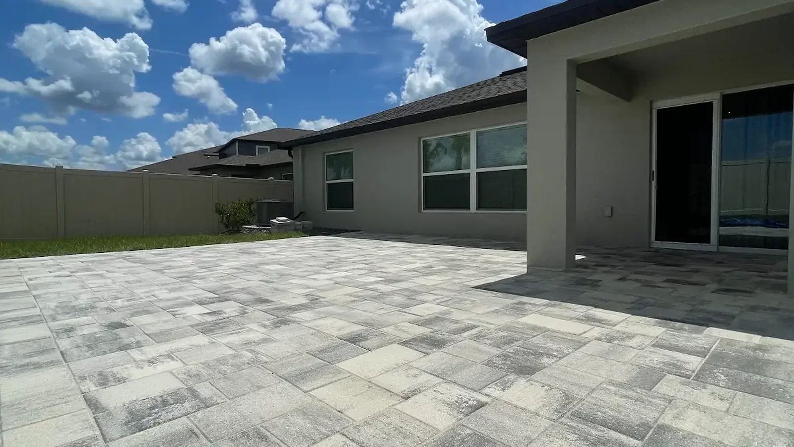can pavers be installed over concrete shown in a real Tampa Bay outdoor project