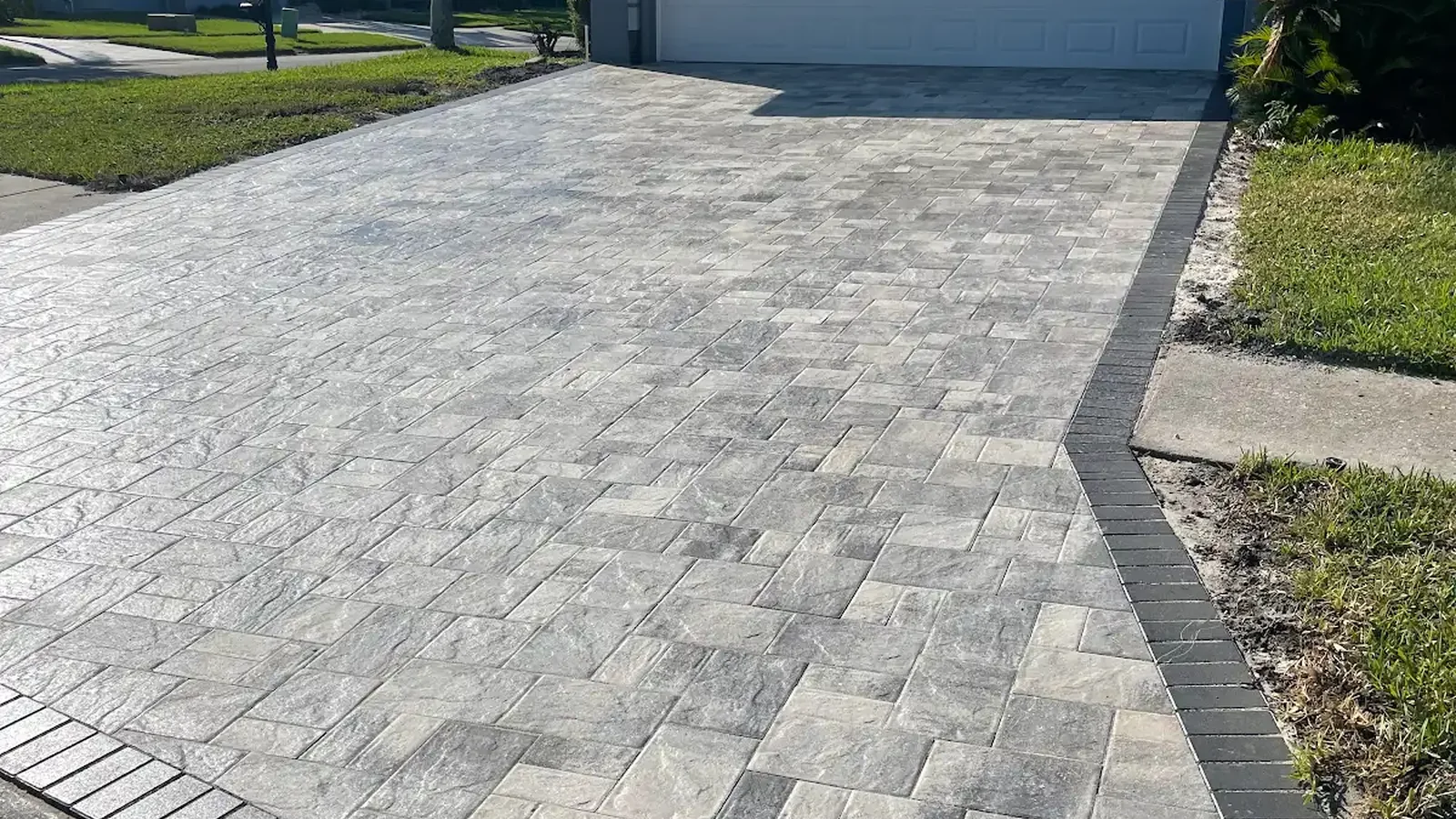 why are my pavers turning white shown in a real Tampa Bay outdoor project