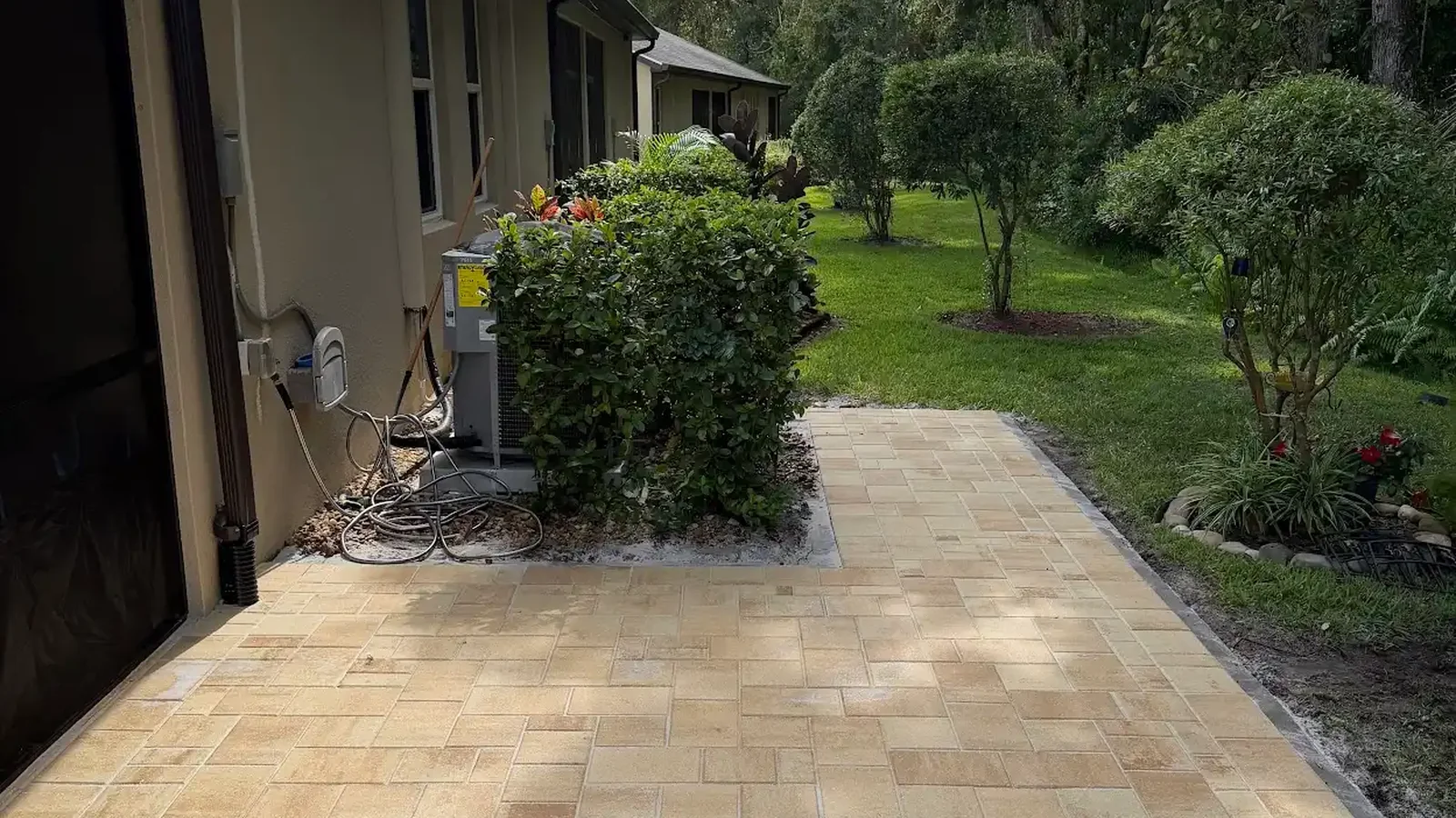 can tree roots damage pavers shown in a real Tampa Bay outdoor project