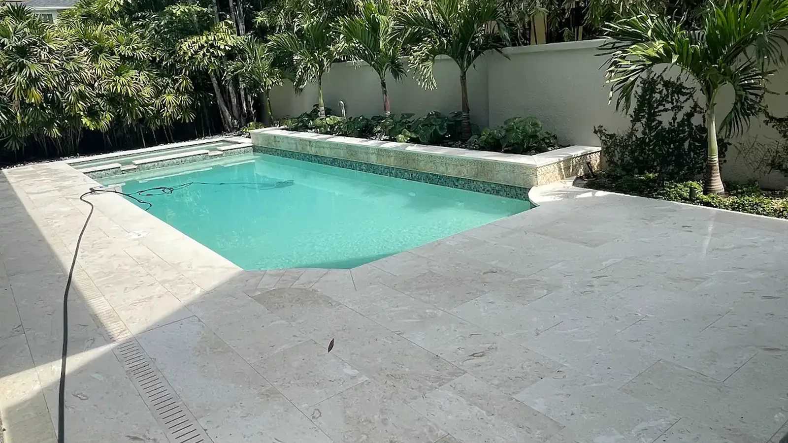 best pool deck materials for Florida heat shown in a real Tampa Bay outdoor project