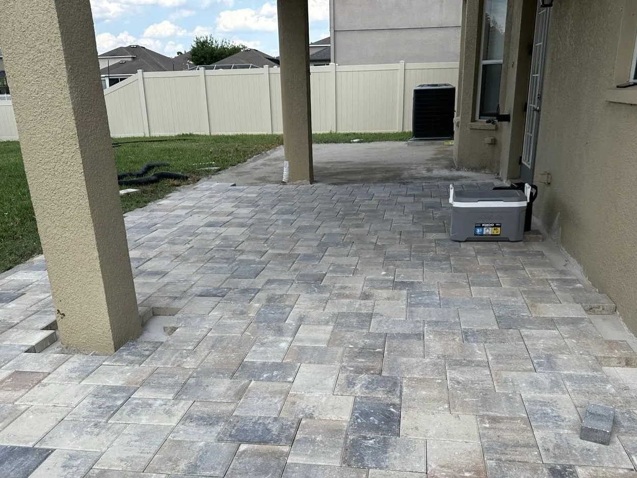 Residential paver patio before cleaning and sealing in Tampa Bay