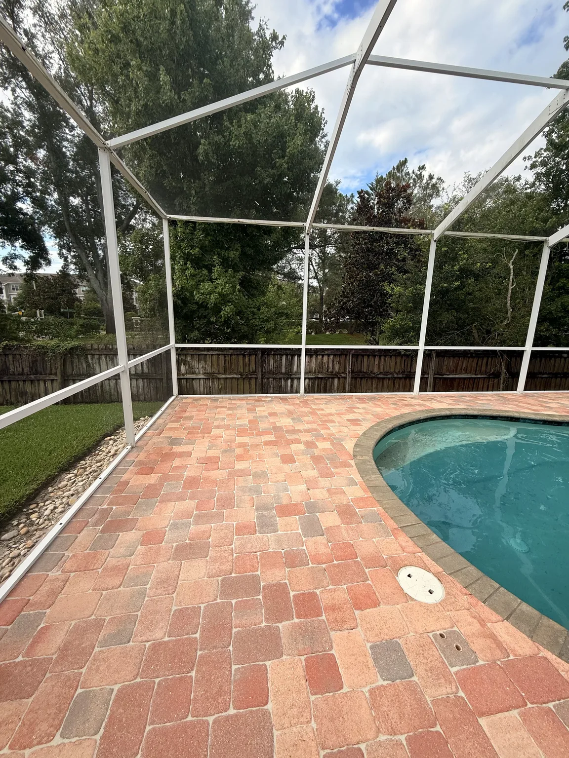 Restored pool deck after paver repair and sealing in Tampa Bay