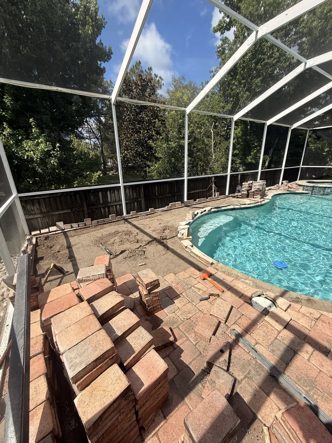 Pool deck before paver repair and sealing service in Tampa Bay